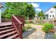 Inviting backyard with a stone patio, a garden bed and direct access to the wooden deck at 176 Ormond Se St, Atlanta, GA 30315