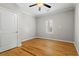 Bedroom with hardwood floors, plantation shutters, and ceiling fan at 176 Ormond Se St, Atlanta, GA 30315