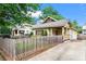 Charming single-story home with a manicured lawn, picket fence, and small front porch at 176 Ormond Se St, Atlanta, GA 30315