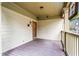 Covered front porch with a wood floor, stained glass window, and view of the yard at 176 Ormond Se St, Atlanta, GA 30315