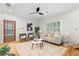 Bright living room with hardwood floors, fireplace, ceiling fan, and modern furnishings at 176 Ormond Se St, Atlanta, GA 30315