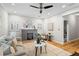 Bright living room with hardwood floors, fireplace, ceiling fan, and modern furnishings at 176 Ormond Se St, Atlanta, GA 30315