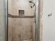 Close up of shower featuring tile surround, bench and multiple shower heads at 176 Ormond Se St, Atlanta, GA 30315
