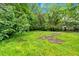 A spacious backyard, surrounded by mature trees at 2326 Brackett Sw St, Marietta, GA 30060