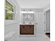 Sleek bathroom with double sinks, modern lighting, and a stylish vanity at 2326 Brackett Sw St, Marietta, GA 30060