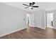 A bright bedroom with hardwood floors and a ceiling fan offers lots of room at 2326 Brackett Sw St, Marietta, GA 30060
