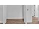 Partially opened closet door, white walls and wood-look flooring at 2326 Brackett Sw St, Marietta, GA 30060