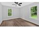 Bright and airy bedroom features wooden floors and a ceiling fan at 2326 Brackett Sw St, Marietta, GA 30060