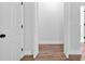 Hallway leading to closet that has white, louvered doors and lots of storage space at 2326 Brackett Sw St, Marietta, GA 30060