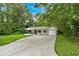 Beautiful exterior view of home, including a long driveway and manicured lawn at 2326 Brackett Sw St, Marietta, GA 30060
