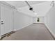 Bright garage features windows, white door, and lots of ceiling lights at 2326 Brackett Sw St, Marietta, GA 30060