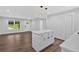 A modern open concept kitchen with an island and stainless steel appliances at 2326 Brackett Sw St, Marietta, GA 30060