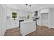 Well-lit kitchen with a functional island, modern appliances, and lots of storage at 2326 Brackett Sw St, Marietta, GA 30060