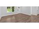 Inviting living area featuring wood-look laminate flooring and a white door at 2326 Brackett Sw St, Marietta, GA 30060