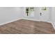 Bright and airy living area with wood-look laminate flooring and a white door at 2326 Brackett Sw St, Marietta, GA 30060