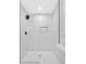 Bright tiled shower with a rainfall shower head and a niche for toiletries at 2326 Brackett Sw St, Marietta, GA 30060
