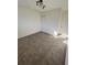 Spacious bedroom with carpet and modern lighting at 4701 Flat Shoals Rd # 48B, Union City, GA 30291