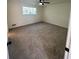 Spacious bedroom with window and ceiling fan at 4701 Flat Shoals Rd # 48B, Union City, GA 30291
