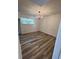 Bright dining room with wood-look floors and a modern chandelier at 4701 Flat Shoals Rd # 48B, Union City, GA 30291
