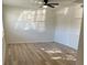 Bright living room featuring wood-look floors and a ceiling fan at 4701 Flat Shoals Rd # 48B, Union City, GA 30291
