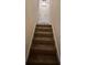 Carpeted staircase leading to the next level at 4701 Flat Shoals Rd # 48B, Union City, GA 30291