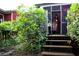 Charming back porch with string lights and greenery creates a cozy and inviting outdoor retreat at 611 Pickett Se St, Atlanta, GA 30316