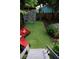 Inviting backyard features vibrant graffiti art, artificial turf, and lounge furniture for outdoor relaxation at 611 Pickett Se St, Atlanta, GA 30316