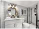Bathroom with black hardware and glass shower with a tiled backsplash at 611 Pickett Se St, Atlanta, GA 30316