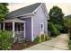 Charming home with a well-maintained exterior, including a inviting front porch and landscaping at 611 Pickett Se St, Atlanta, GA 30316