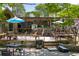 A restaurant exterior view with patio seating surrounded by trees at 611 Pickett Se St, Atlanta, GA 30316