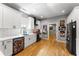 Modern kitchen with white cabinets, hardwood floors, stainless steel appliances, and stylish backsplash at 611 Pickett Se St, Atlanta, GA 30316