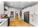 Well-lit kitchen featuring white cabinetry, stainless steel appliances, and an open layout at 611 Pickett Se St, Atlanta, GA 30316