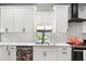 Kitchen detail featuring white subway tile backsplash and updated countertops at 611 Pickett Se St, Atlanta, GA 30316