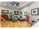 Bright and airy living room featuring hardwood floors, a comfortable gray sofa, and eclectic decor at 611 Pickett Se St, Atlanta, GA 30316