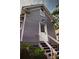 Charming home featuring back entry with painted stairs and clean, purple siding at 611 Pickett Se St, Atlanta, GA 30316
