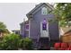 Rear elevation showcasing a backyard patio and second story with purple accent lighting at 611 Pickett Se St, Atlanta, GA 30316