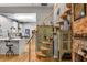 Modern spiral staircase adjacent to a kitchen with white cabinetry, hardwood floors, and stylish accents at 611 Pickett Se St, Atlanta, GA 30316