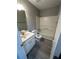 A view of a well-lit bathroom featuring a vanity, toilet, and shower-tub combo with gray walls at 5388 Robertson Path, Lithonia, GA 30038
