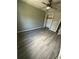 An open bedroom featuring updated floors, a ceiling fan and closet at 5388 Robertson Path, Lithonia, GA 30038