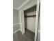A view of an open closet with a built-in storage, and bi-fold door in a bedroom at 5388 Robertson Path, Lithonia, GA 30038