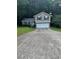 Charming two-story home featuring a two-car garage and a well-maintained front yard at 5388 Robertson Path, Lithonia, GA 30038