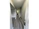Welcoming hallway with modern gray laminate flooring that leads into the main living spaces at 5388 Robertson Path, Lithonia, GA 30038