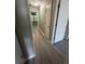 Hallway featuring updated floors and neutral paint at 5388 Robertson Path, Lithonia, GA 30038
