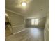 Bright and airy living room with neutral colors, laminate flooring, and large windows at 5388 Robertson Path, Lithonia, GA 30038