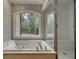 Relaxing bathroom with a jetted tub and separate glass shower at 80 Surrey Chase Drive, Social Circle, GA 30025