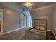 Bedroom with empty wood frame bed and neutral colored walls and carpet at 80 Surrey Chase Drive, Social Circle, GA 30025