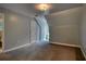 An empty bedroom shows neutral walls, carpet, and door to hall at 80 Surrey Chase Drive, Social Circle, GA 30025