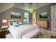 Cozy bedroom featuring a large bed, stylish furnishings, and an ensuite bathroom at 80 Surrey Chase Drive, Social Circle, GA 30025