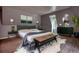 Well-decorated bedroom with a comfortable bed, stylish furniture, and ample natural light at 80 Surrey Chase Drive, Social Circle, GA 30025