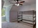 Gray bedroom features a bunk bed for flexible sleeping arrangements and a ceiling fan at 80 Surrey Chase Drive, Social Circle, GA 30025